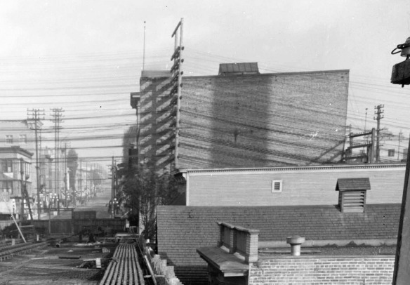 Construction of the first Georgia Viaduct, looking east toward Main Street, around 1913. The big building on the right is the rear of the Avenue Theatre. The top of 102 East Georgia can be seen just below it. City of Vancouver Archives #LGN 1188 (cropped)