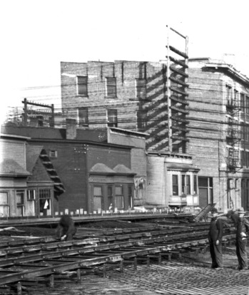 A rare photo showing the former brothels on the north side of Shore Street after the 1912 relocation of the "restricted district"  to Alexander Street, during the construction of the original Georgia Viaduct. CVA #LGN 1188 (cropped)